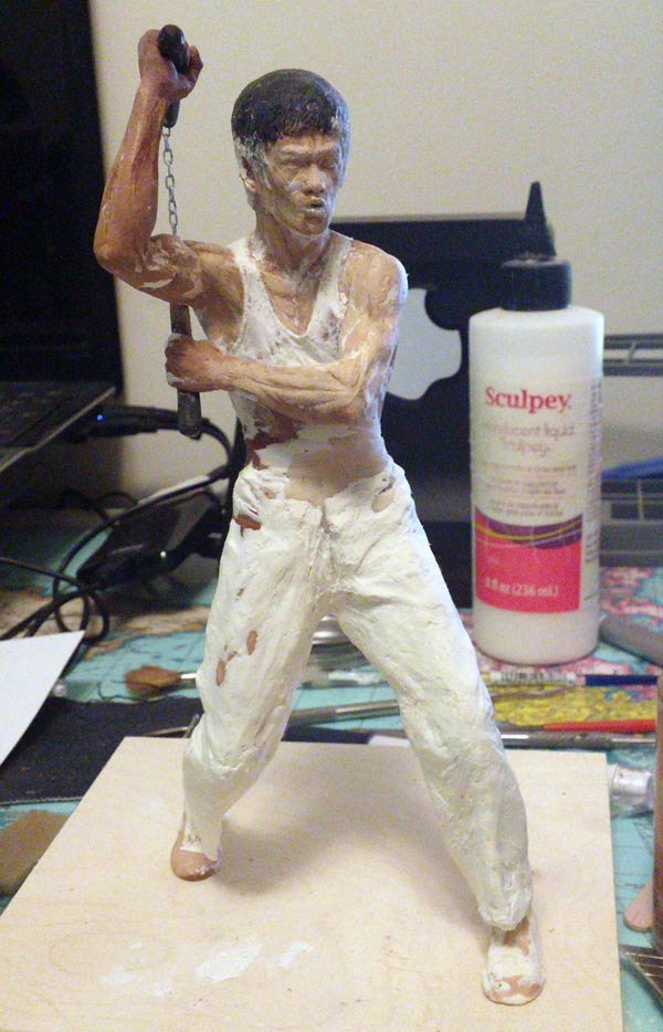 Tang Lung statue from The Way of the Dragon on desk