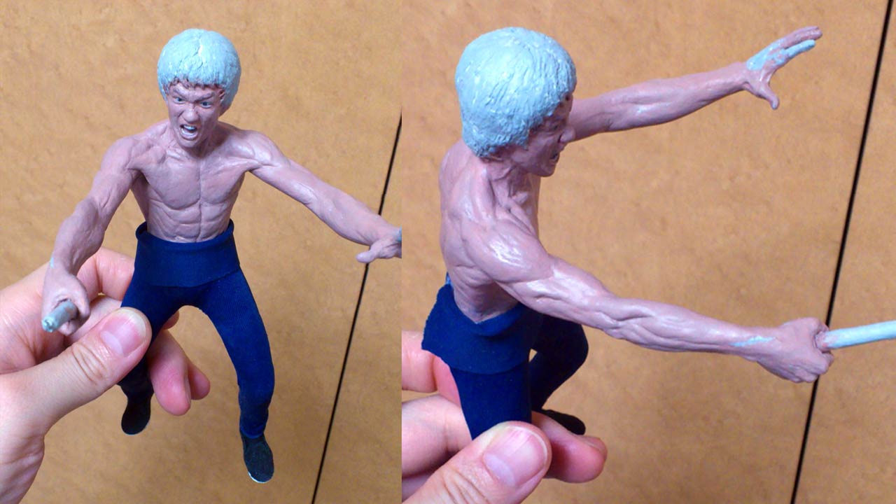 Two images side by side in a medium close up of Mister LEE fully painted with skin and facial features except the hair